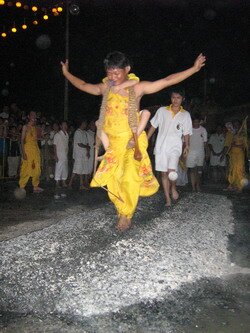 Spirit Medium crossing the fire walk in Penang Festivals
