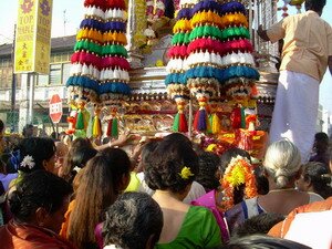 Devotees pushing the chariot during Thaipusam Penang