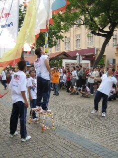 chingay on bench during chap goh meh in penang