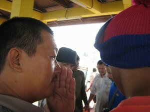 Man whispering during auction in Kuala Muda Kedah