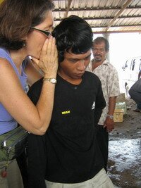 Lady whispering during auction in Kuala Muda Kedah