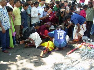 Being held down for skewring thaipusam penang