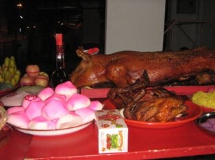 Roasted pig and chicken are offerings to Jade Emperor