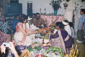 Both bride and groom parents accepting the agreement tray in Malaysian Indian Engagement