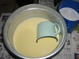 Mixing egg and coconut cream batter