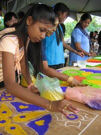 Making coconut kolam in Mak Mandin Penang