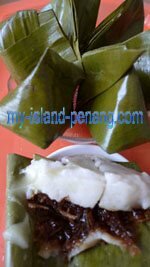 Kuih Koci santan, sweet steamed cakes wrapped in banana leaves