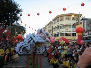 Excited Lion dancing on 10ft stand in Penang