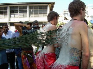 Skewered back of Love and Catchpole in Thaipusam Penang
