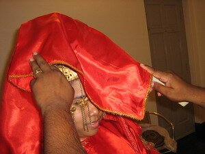Jivan tries the ceremonial unveiling of the bride