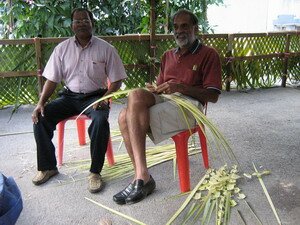 preparing leaves to cover sides of panthals thaipusam penang