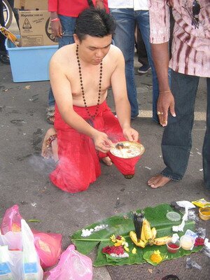 Patrick offering prayers during Thaipusam