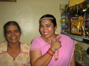 Prays to home altar at coming of age rituals