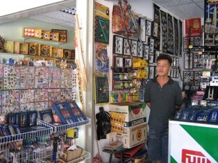 Mr Sim in Penang Snake Temple souvenir shop