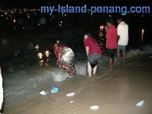 Sending off the lighted styrofoam lantern in Teluk Bahang Penang