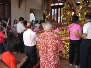 Praying to Buddha in Jade Emperor Temple Penang