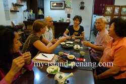 Penang Home Cooking Registration, Tom and Naomi enjoying Nyonya Food in Red Chopstick